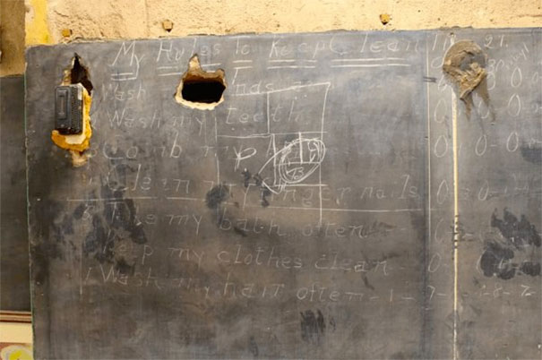 When new chalkboards were installed in 1917, they simply fastened them over the old ones. 